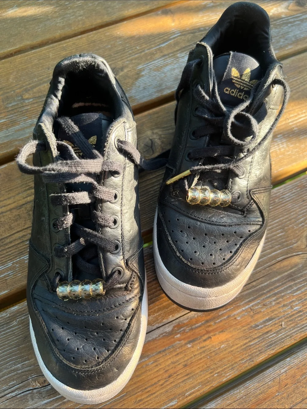 adidas Forum Black Leather Low-Top Sneakers with Gold Accents